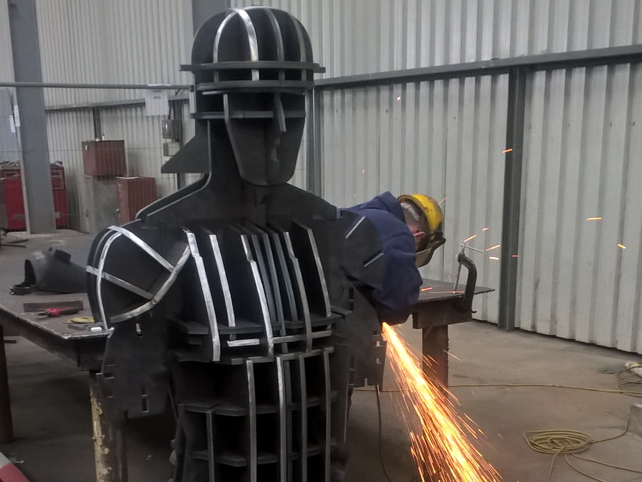 An image of a WD Close worker fabricating the Centurion Statue.